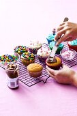 Cupcake Decorating Scene; Cupcakes on Cooling Rack; Icing