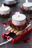 Tealight holder decorated with washi tape and decorative pebbles in small tart tin