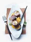 Chocolate pancakes with apricot & quark filling and star fruit