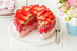 Strawberry ice cream cake with strawberry sorbet and nuts