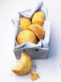 Cheese-sesame rolls in a bread basket