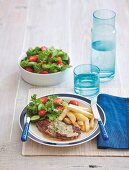 Steak Diane with chips and a side salad