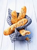 Beer bread baguette rolls with caraway seeds in a bread basket