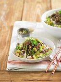 Strips of beef with rice noodles and vegetables