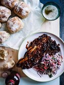 Beef rib with coleslaw and onion bread rolls