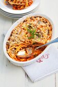 Baked macaroni with tomato sauce and white beans
