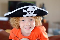 A boy wearing a pirate hat