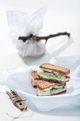 Slices of wholemeal bread topped with herb quark and vegetables