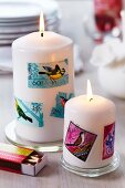 Stamps with bird motifs stuck on pillar candles