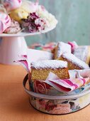 Sponge cake with jam and grated coconut in an antique tin