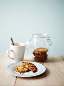 Anzac biscuits (Australia) in a jar and on a plate