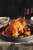 Roast duck with apples and onions
