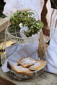 Freshly made waffles on polka dot cloth on wire cake stand