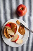 Pieces of apple with peanut butter