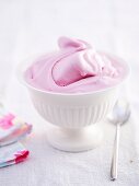 A bowl of creamy raspberry ice cream