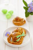 Yeast pretzels on a plate and behind