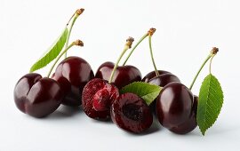 Whole and halved morello cherries