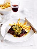 Onglet steak with herb butter and skinny chips