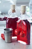 Cherry liqueur in small bottles decorated with fake cherries