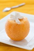 A frozen orange with a flower