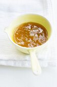 Apricot jam with ginger in a small saucepan