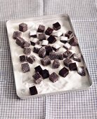 Home-made blueberry jelly sweets with sugar on a baking tray