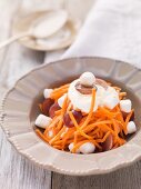 Carrot salad with grapes and marshmallows