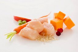 Raw Cubes of Chicken with Assorted Ingredients
