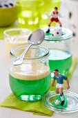 Woodruff jelly with vanilla sauce and football decorations