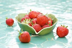 Fresh strawberries in a leaf-shaped bowl