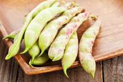 Scarlet runner beans in a wooden bowl