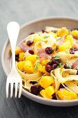Tagliatelle with squash, cranberries and parsley