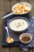 Cream of onion soup with caraway and croutons