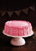 Raspberry layer cake on a cake stand