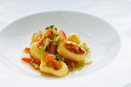 Potato gnocchi with tomatoes and savoy cabbage