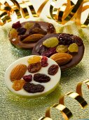 Chocolate buttons with dried fruits and almonds