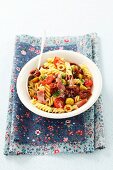 Pasta salad with sausage, dried tomatoes and parsley