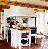 Chopping block table next to rustic kitchen cooker in Scandinavian country house