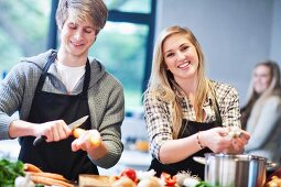 Young couple preparing food