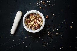 Egyptian dukkah spice mix with nuts in a mortar