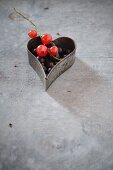 Blackcurrants and redcurrants in a heart-shaped cutter