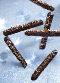 Peanut brittle sticks coated in chocolate
