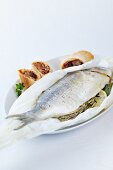 Gilt-head bream, cooked in baking parchment, with a ratatouille strudel