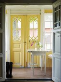 View into hallway with yellow front door