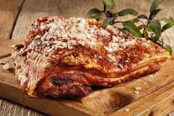 Roast belly pork on chopping board