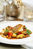 Fish fillet with artichokes and chickpeas
