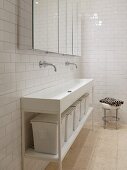 Long washstand with storage baskets and mirrored wall cabinets in white, minimalist bathroom