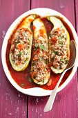 Courgettes stuffed with minced meat and rice, in tomato sauce