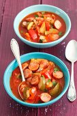 Sausage stew with peppers, tomatoes and courgette