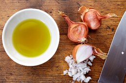 Shallots Bing Finely Chopped and a Dipping Bowl of Olive Oil
